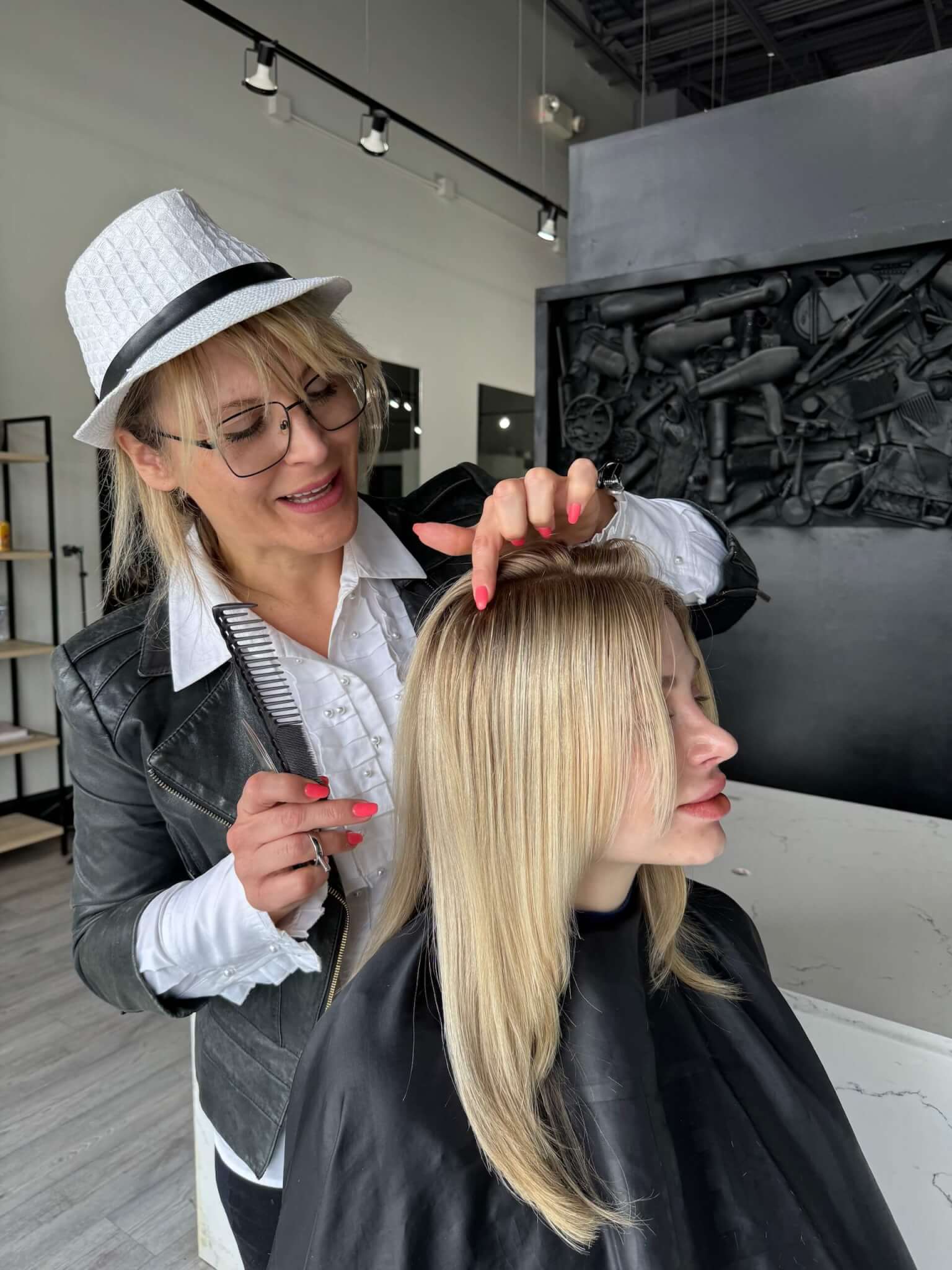 Woman brushing her long, healthy hair extensions.